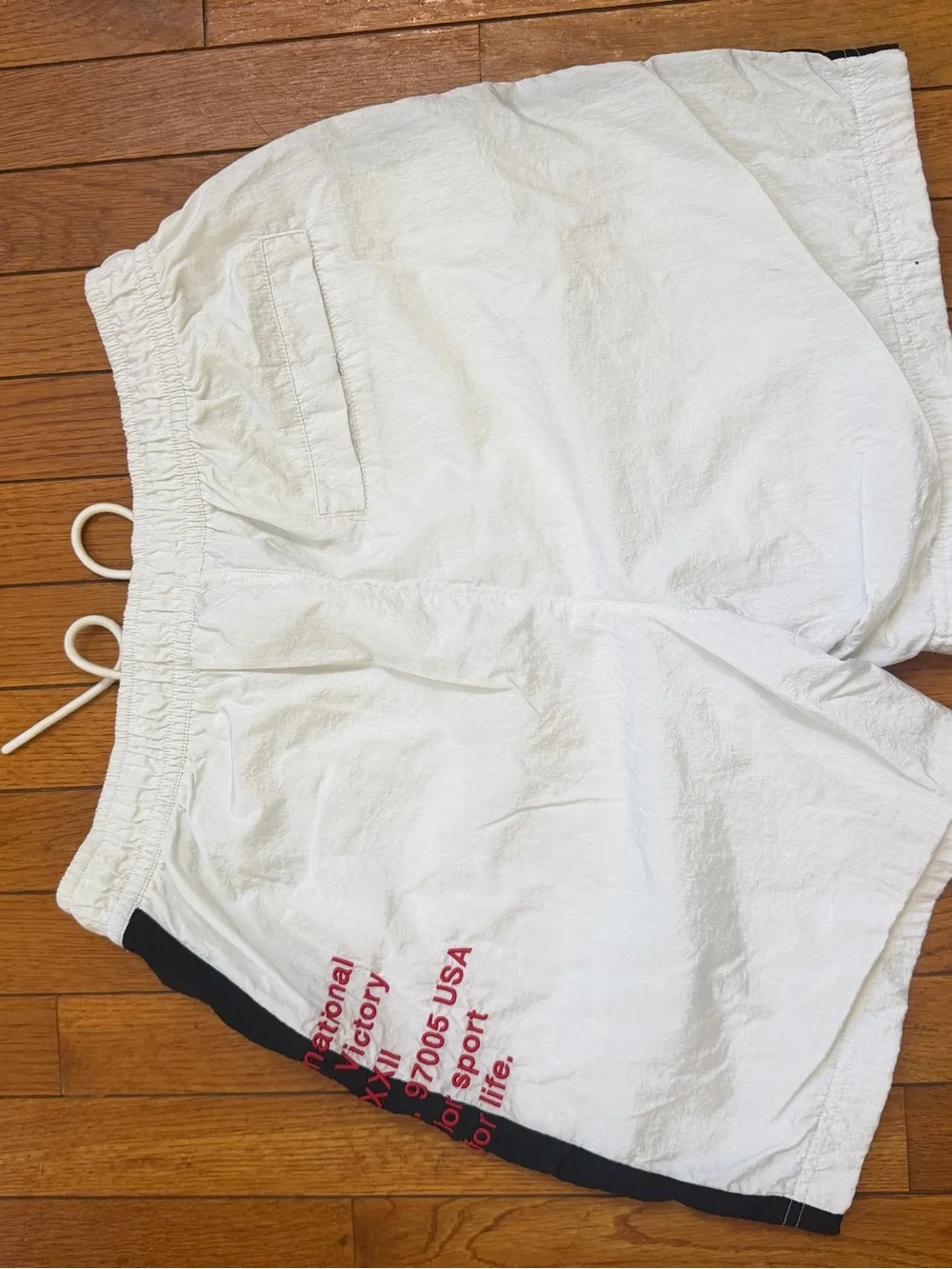 Nike White Swim Trunks with Black Panels and Red Script